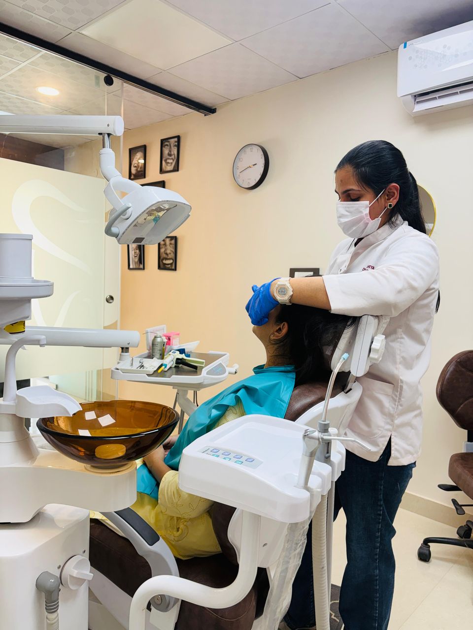 A procedure in progress at the dental chair in the clinic